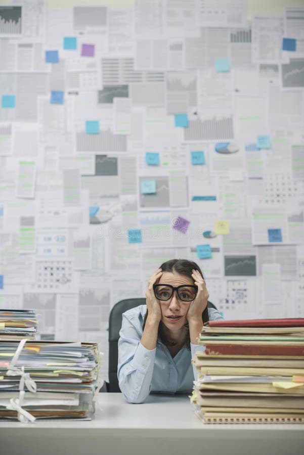 Stressed businesswoman overloaded with work