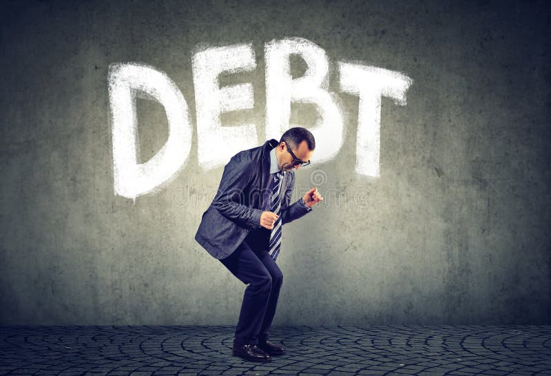 Stressed business man under debt pressure financial burden stock image Stressed business man under debt pressure financial burden stock image