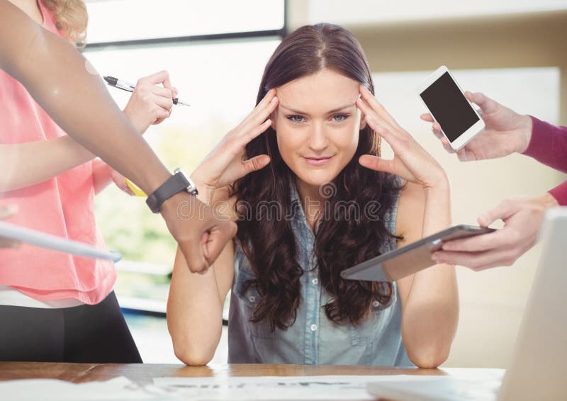 Stressed woman at desk surrounded by technology phone tablet and files royalty free stock photos Stressed woman at desk surrounded by technology phone tablet and files royalty free stock photos
