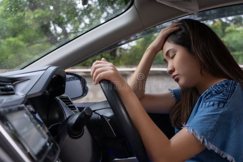 Stressed woman drive car feeling sad and angry. Asian girl tired, fatigue on car. Driver tired drowsy, drink donâ€™t drive concept