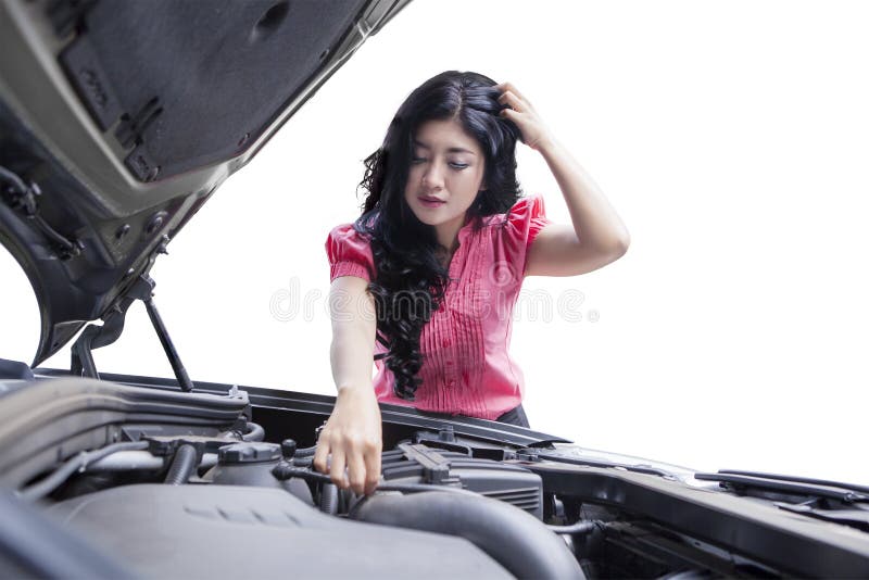 Stressful woman checking broken car machine stock photo Stressful woman checking broken car machine stock photo