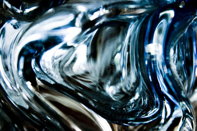 Curved glass abstract with flowing fluid shapes. Curved glass abstract with flowing fluid shapes.