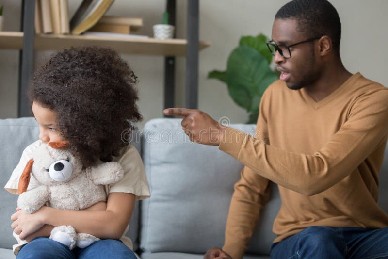 Strict black dad discipline offended preschooler daughter royalty free stock images Strict black dad discipline offended preschooler daughter royalty free stock images