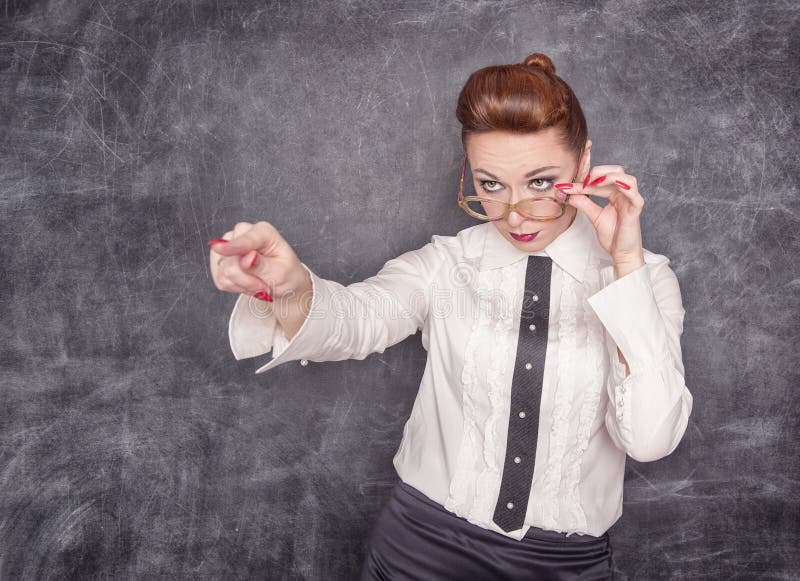 Strict teacher showing on someone by finger stock photography Strict teacher showing on someone by finger stock photography