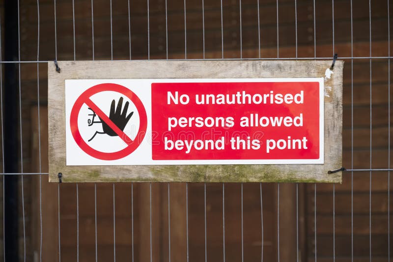 Strictly no unauthorised access sign at construction site security door stock photography