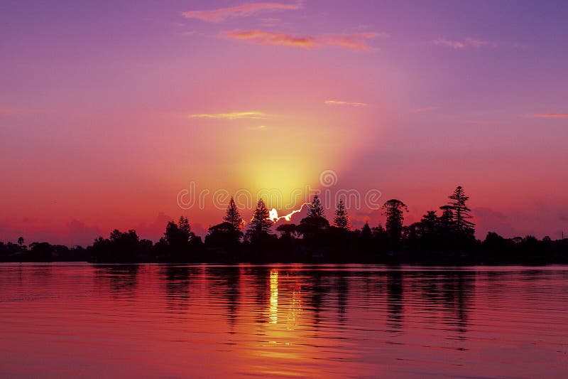 Magnificent red cloud coastal sunrise vista. Australia.