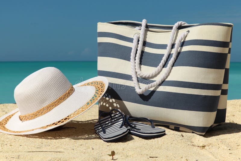 Bag, Hat and Flip-flops on the Beach Stock Image - Image of clouds ...