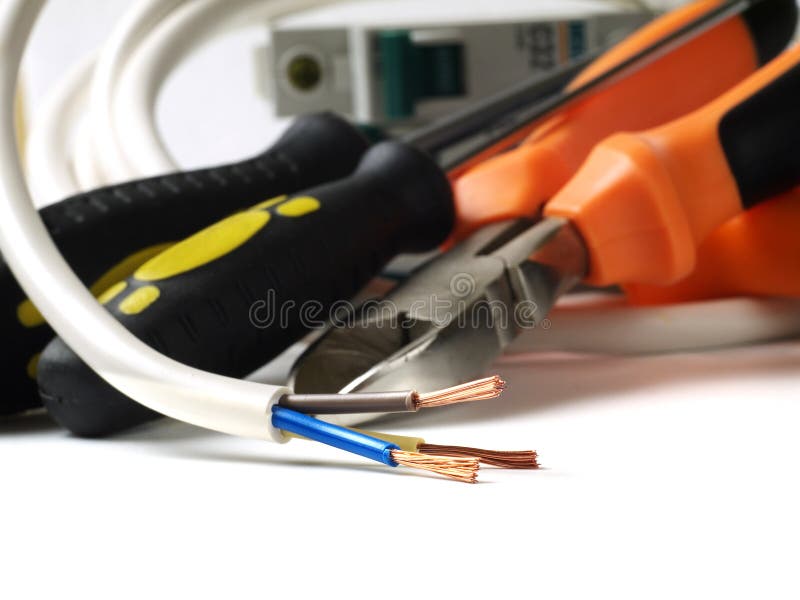 Stripped Wire in Front of Electric Tools and Equipment Stock Photo