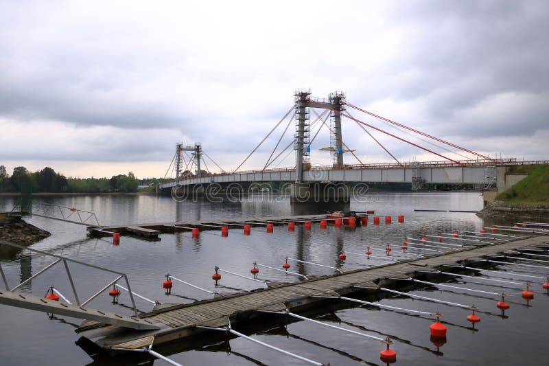 The Stromsund bridge in Stroms vattudal, an extensive water system in Swedish Jamtland in summer on a cloudy day