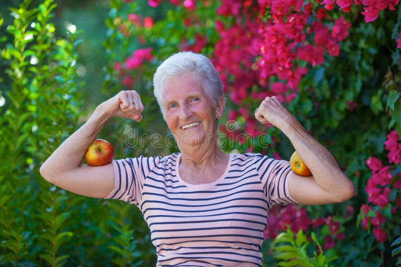 Christian Senior Woman Arms Outstretched With Praise Stock