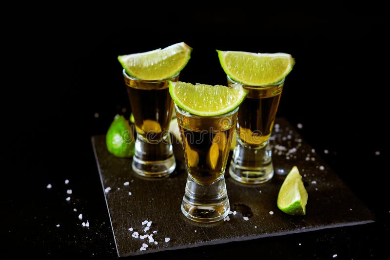 Strong Alcohol Drinks. Tequila Shots with Salt and Lime Slices. Stock ...