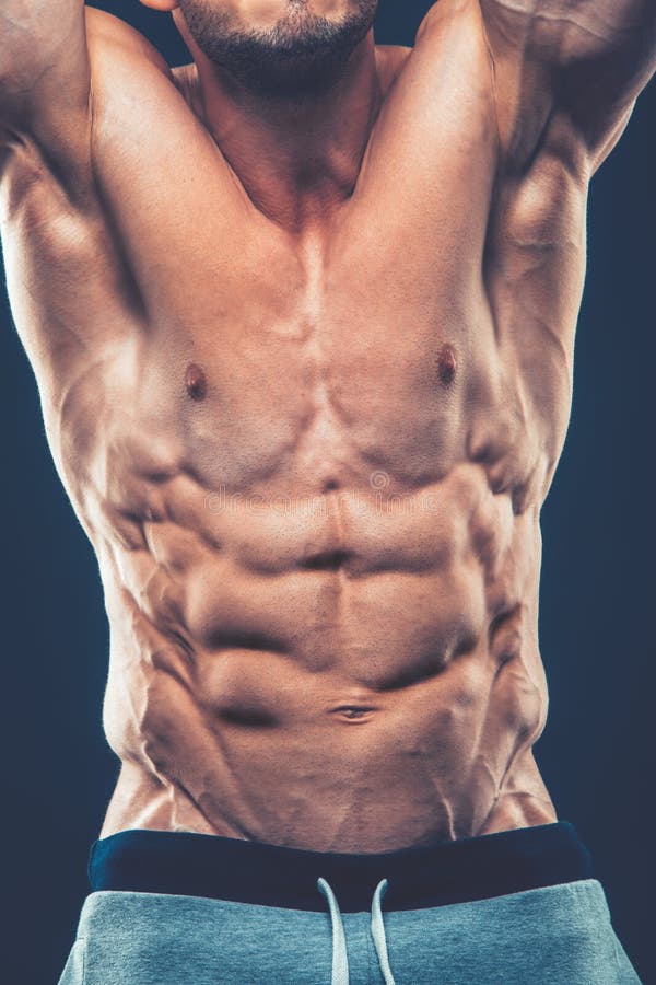 Strong Athletic Man Fitness Model Torso showing six pack abs. is stock photography Strong Athletic Man Fitness Model Torso showing six pack abs. is stock photography