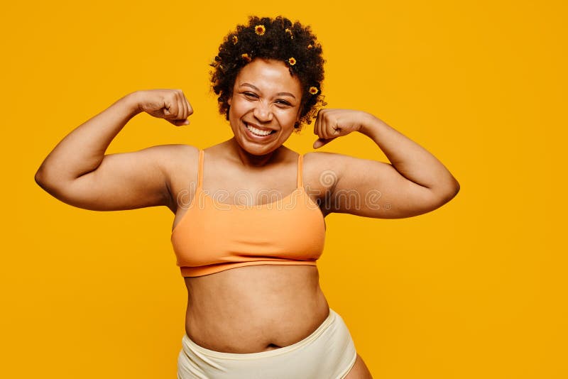 https://thumbs.dreamstime.com/b/strong-black-woman-yellow-waist-up-portrait-powerful-smiling-happily-posing-against-vibrant-background-body-positivity-252412152.jpg