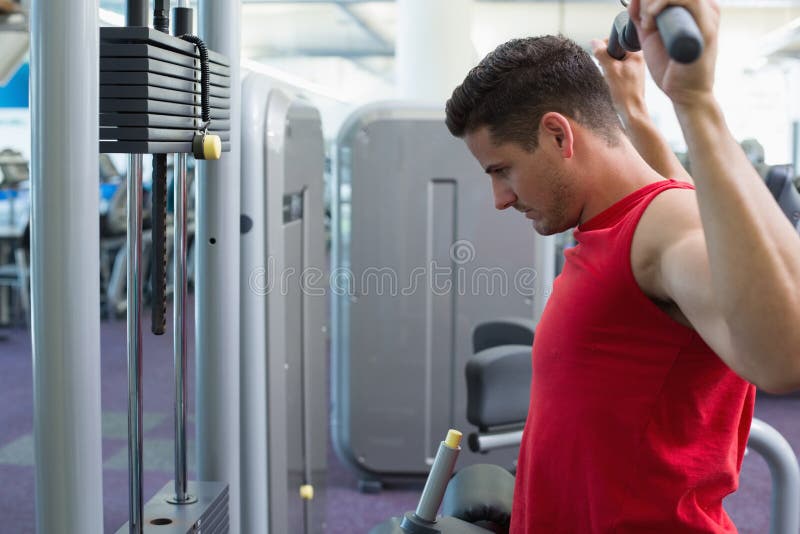 Strong Bodybuilder Using Weight Machine for Arms Stock Image Image of