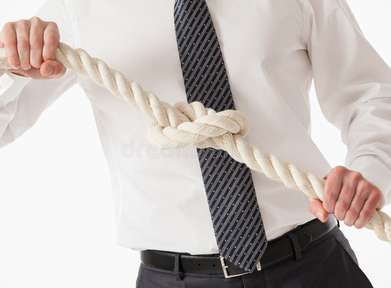 Strong businessman tieing a cable