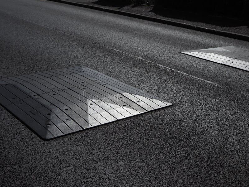 strong graphic close-up of road speed bumps