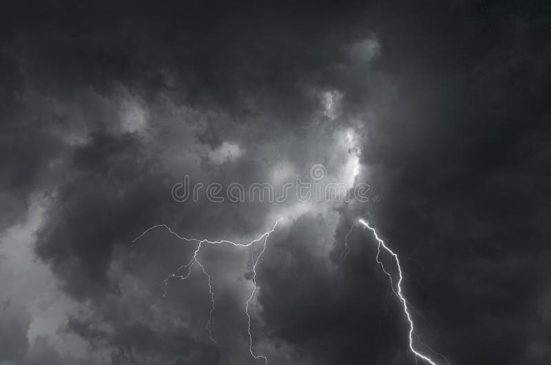 Strong lightning in scary black clouds in monsoon season stock photography