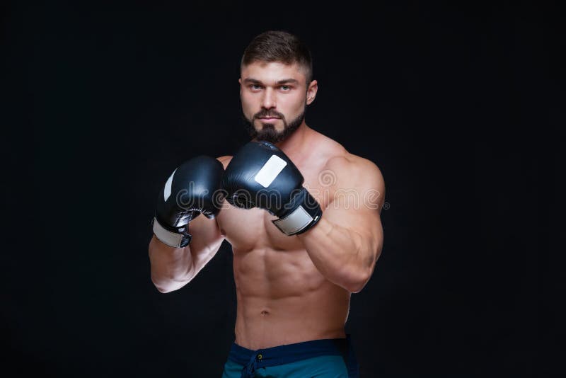 Strong Muscular Boxer in Black Boxing Gloves. on Black Background ...