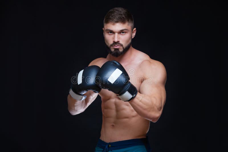 Strong Muscular Boxer in Black Boxing Gloves. Isolated on Black ...