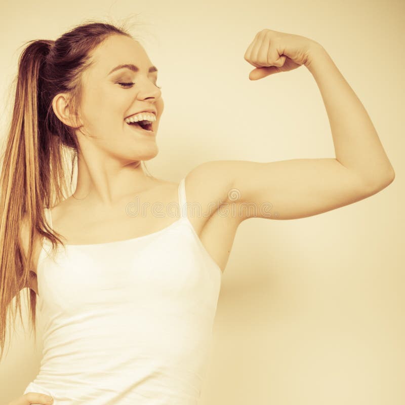 Strong woman showing off muscles. 