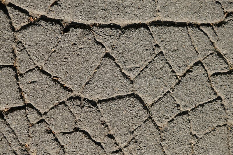 Structure of old cracked asphalt with deep cracks. Abstract grunge texture background. stock photos Structure of old cracked asphalt with deep cracks. Abstract grunge texture background. stock photos