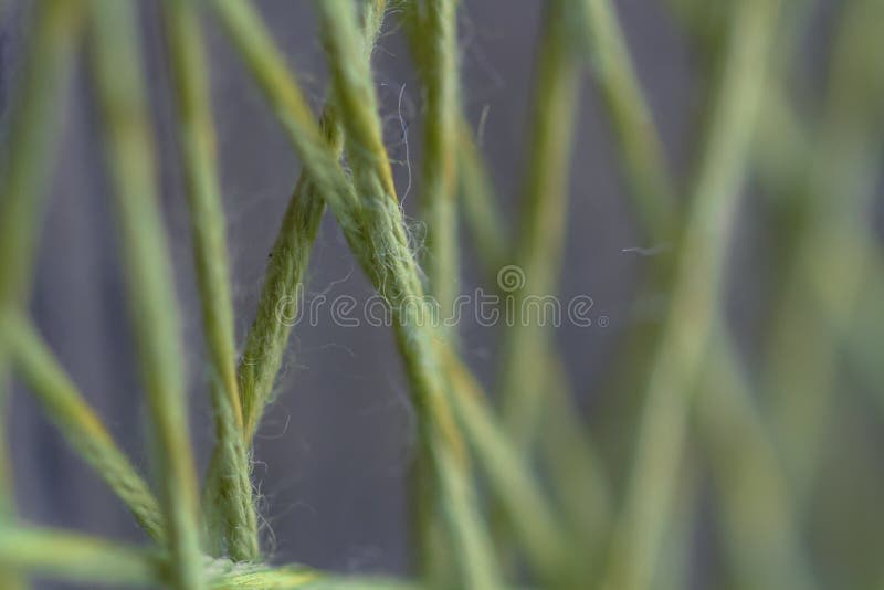 The structure of the tapestry. Geometric lines in weave of thread. Color threads, intersecting lines, pattern geometry, macro photo, fiber structure, rope The structure of the tapestry. Geometric lines in weave of thread. Color threads, intersecting lines, pattern geometry, macro photo, fiber structure, rope