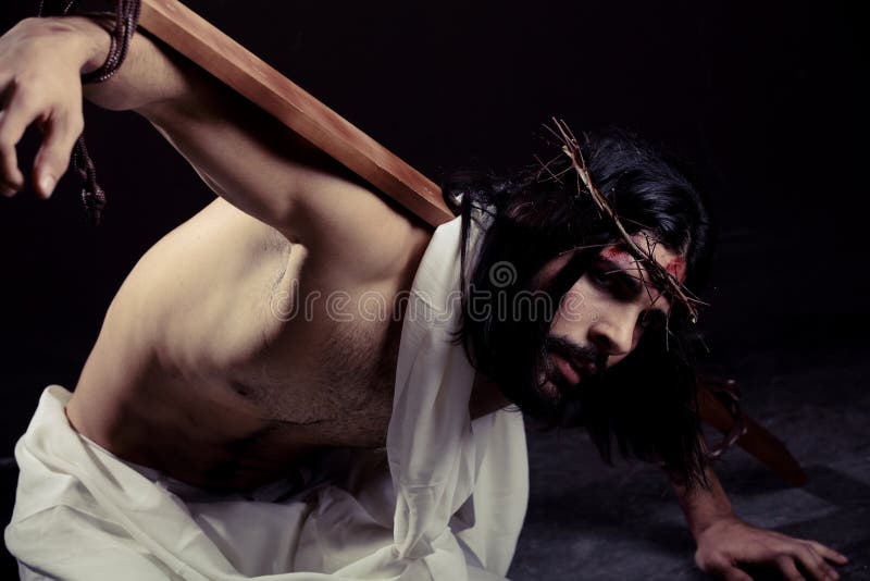 Struggling Jesus Christ for Easter. With the cross on his back stock images
