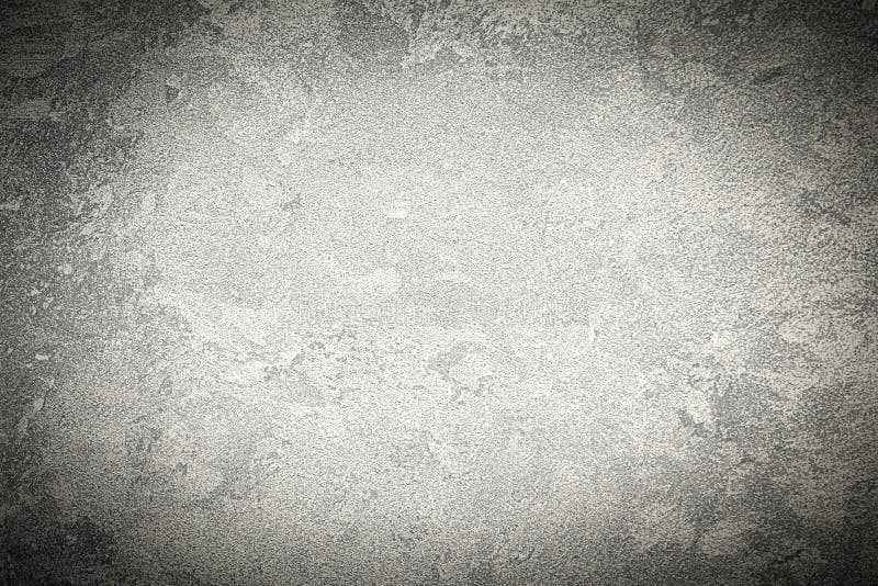 Struktur aus grauem Zierputz oder Beton mit Vignette. abstrakter Hintergrund für Design