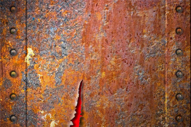 Struttura arrugginita violenta del metallo con i ribattini fotografie stock Struttura arrugginita violenta del metallo con i ribattini fotografie stock