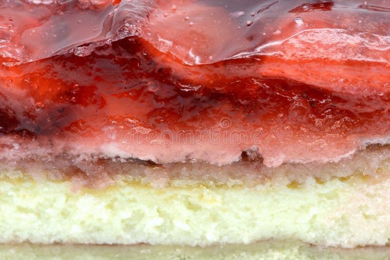 Struttura completa del pezzo del dolce della fragola con gelatina ed il quark fotografia stock Struttura completa del pezzo del dolce della fragola con gelatina ed il quark fotografia stock