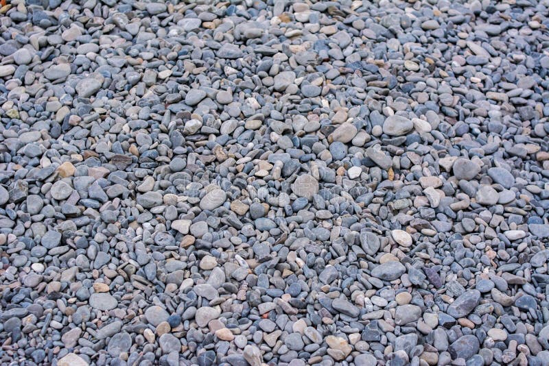 Struttura di piccola roccia delle pietre della ghiaia grigia fotografia stock Struttura di piccola roccia delle pietre della ghiaia grigia fotografia stock
