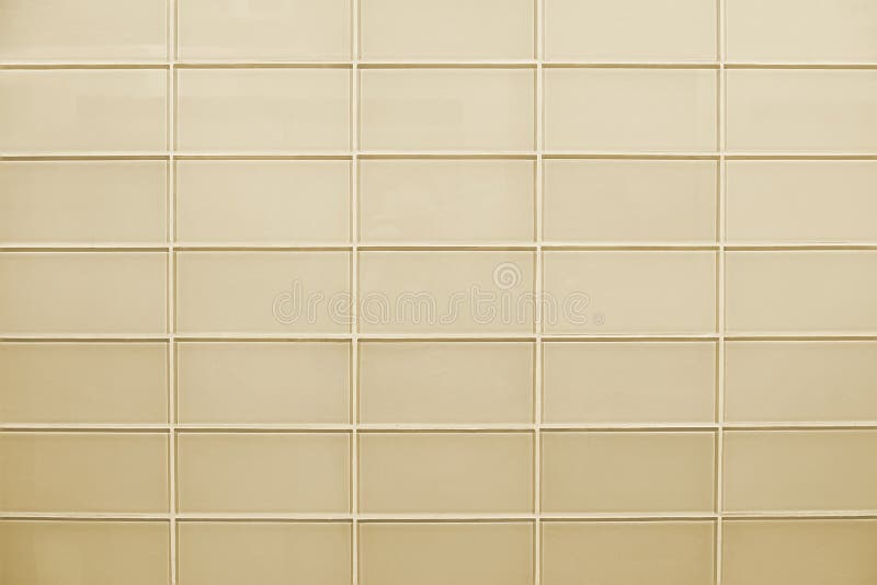 Struttura di vetro beige moderna del fondo del muro di mattoni fotografia stock Struttura di vetro beige moderna del fondo del muro di mattoni fotografia stock