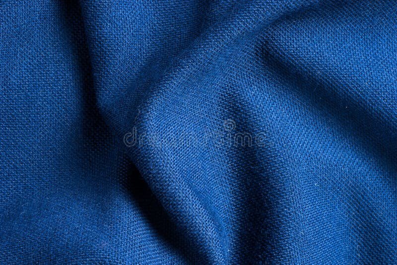Struttura e fondo del tessuto blu del poliestere così bello fotografie stock