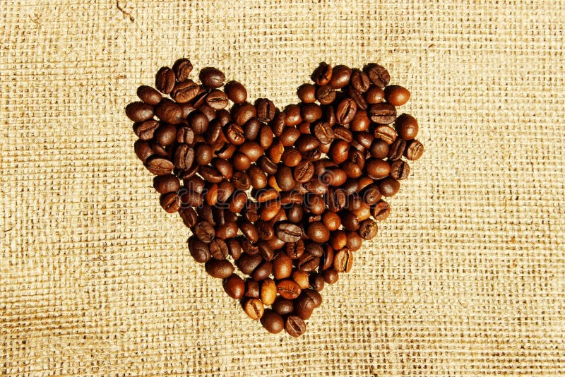 Strutture del caff? di Brown Cuore del caffè sopra il fondo del tessuto Isolated astratto Isolated astratto immagine stock Strutture del caff? di Brown Cuore del caffè sopra il fondo del tessuto Isolated astratto Isolated astratto immagine stock