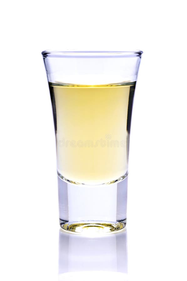 Shot of tequila or whiskey isolated on a white background. Shot of tequila or whiskey isolated on a white background