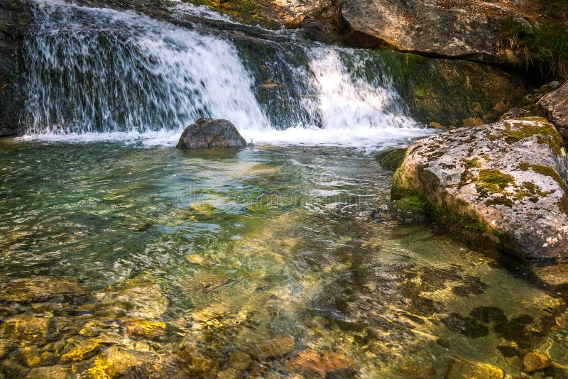 The Studenovodske waterfalls on a stream in the forest