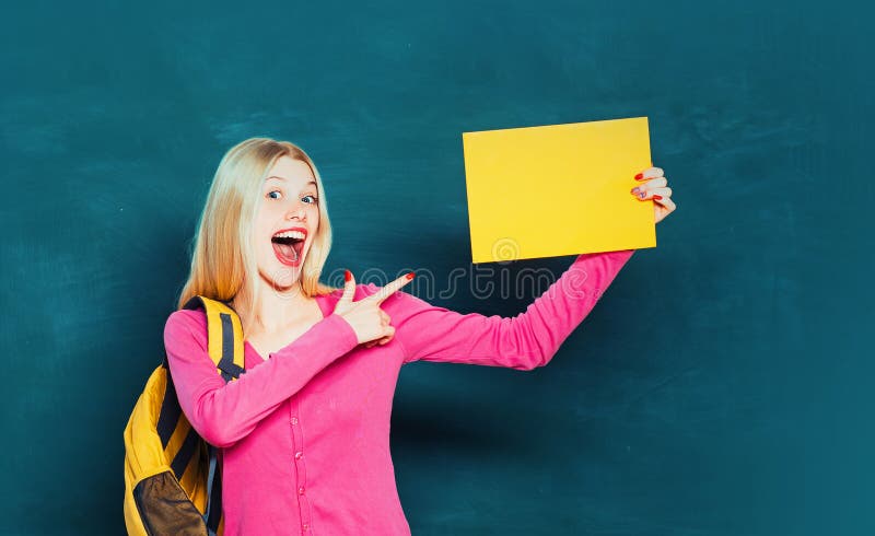 Student with backpack. Formal education. Improving myself through education. Happy girl holding announcement while stand royalty free stock image