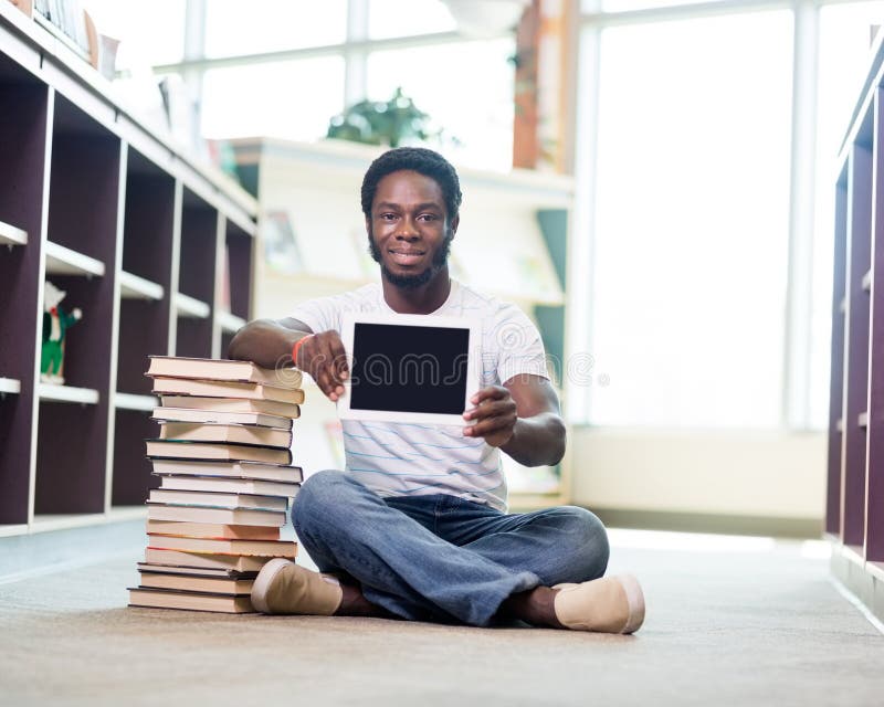 Показывает книгу. Pile books on the Floor.