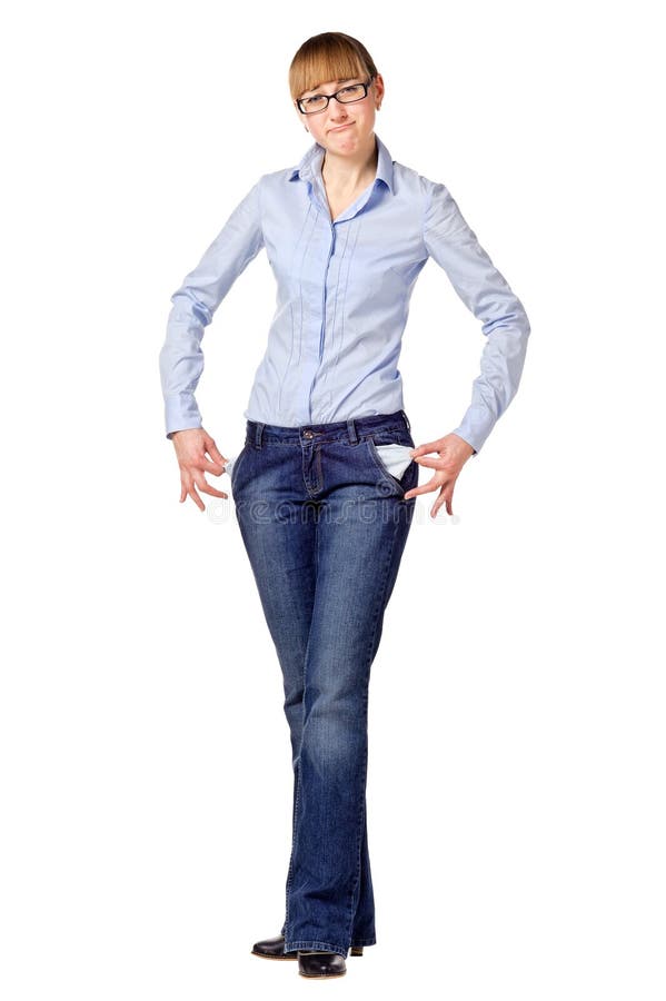 Young Girl Standing and Showing Her Empty Pockets. Stock Photo Image