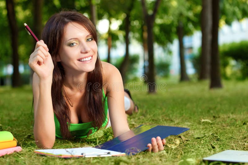 Student girl laying on grass