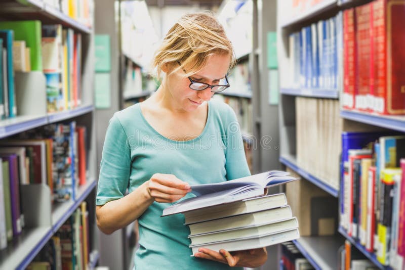 Student girl in the library reading books, education