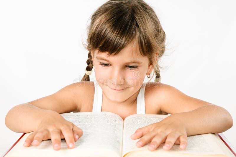 Student girl reading a big book isolated on white