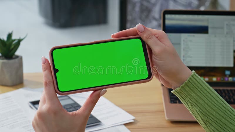 Student hands holding mockup smartphone watching social media at home closeup stock video footage