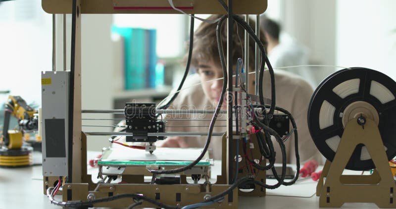 Student learning 3D printing in the lab stock video