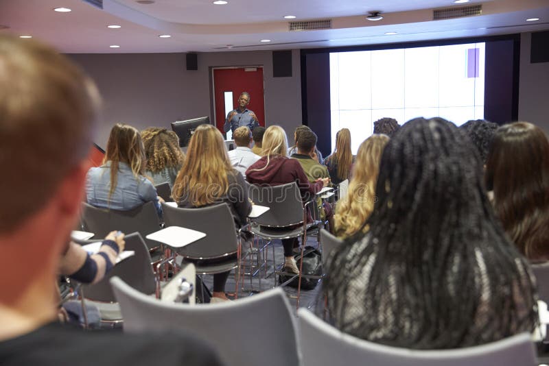Student lecture in modern university classroom, back view stock photography