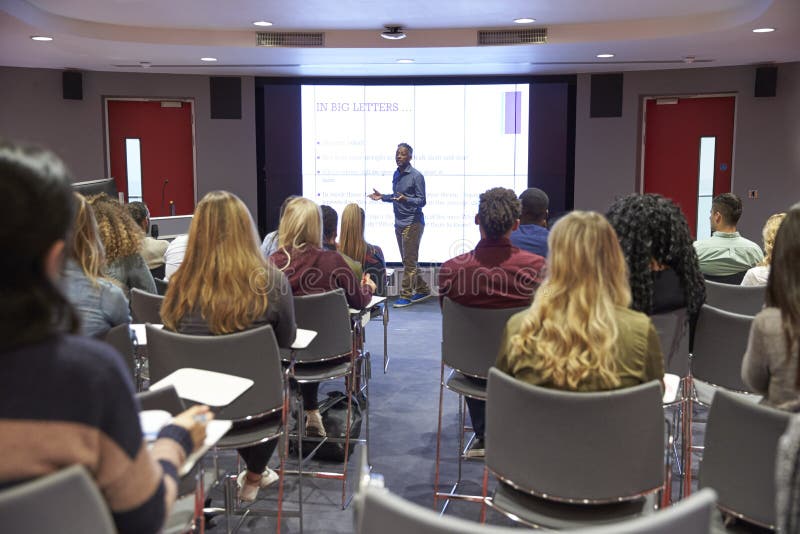 Student lecture in modern university classroom, back view royalty free stock photo