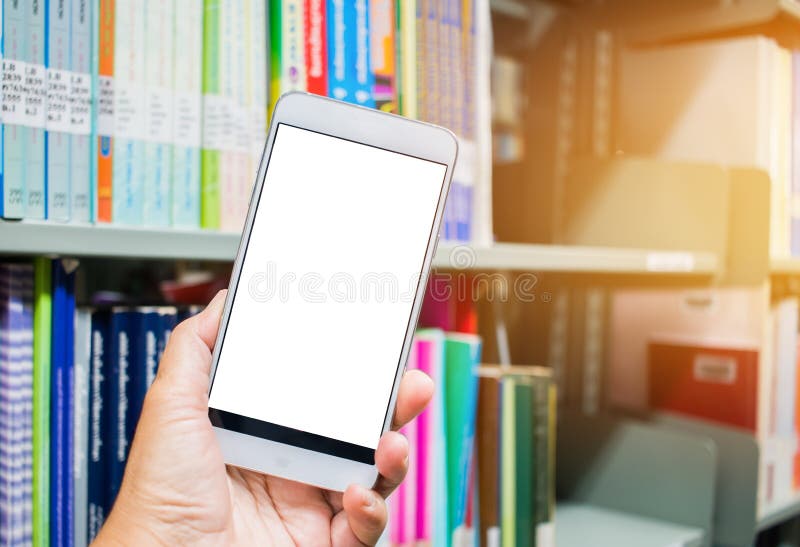 Student Man hand holding mobile smart phone, cellphone over Blur library Book Shelf Natural Background, bokeh out of focus Book stack in library room and blurred bookshelf for business and education