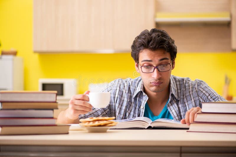 The Student Preparing for Exam Sitting at the Kitchen Stock Photo ...