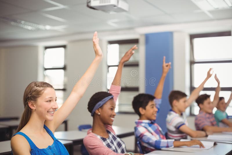 Student Raising Hand In Classroom Stock Image Image Of Intelligent