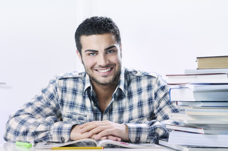 Student smiling with books on white background royalty free stock photography